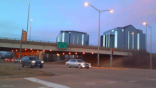 Sample footage captured with the mini keychain camera showing a city scene at blue hour